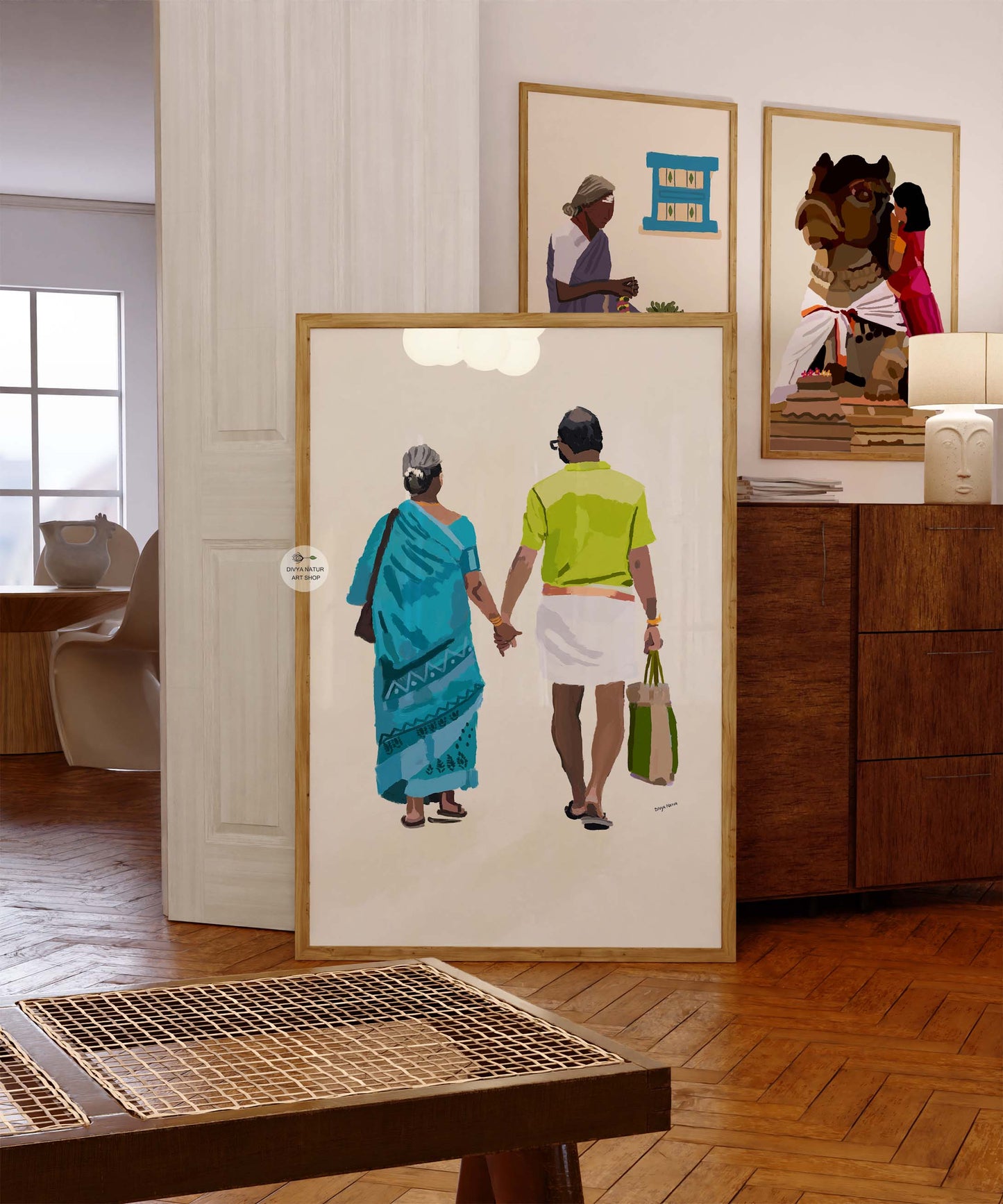 Traditional artwork of an elderly couple walking together, woman in blue saree and man in dhoti.