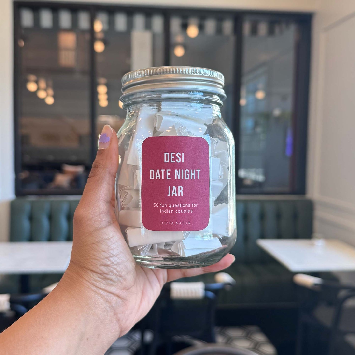 Date night conversation jar filled with playful questions for couples