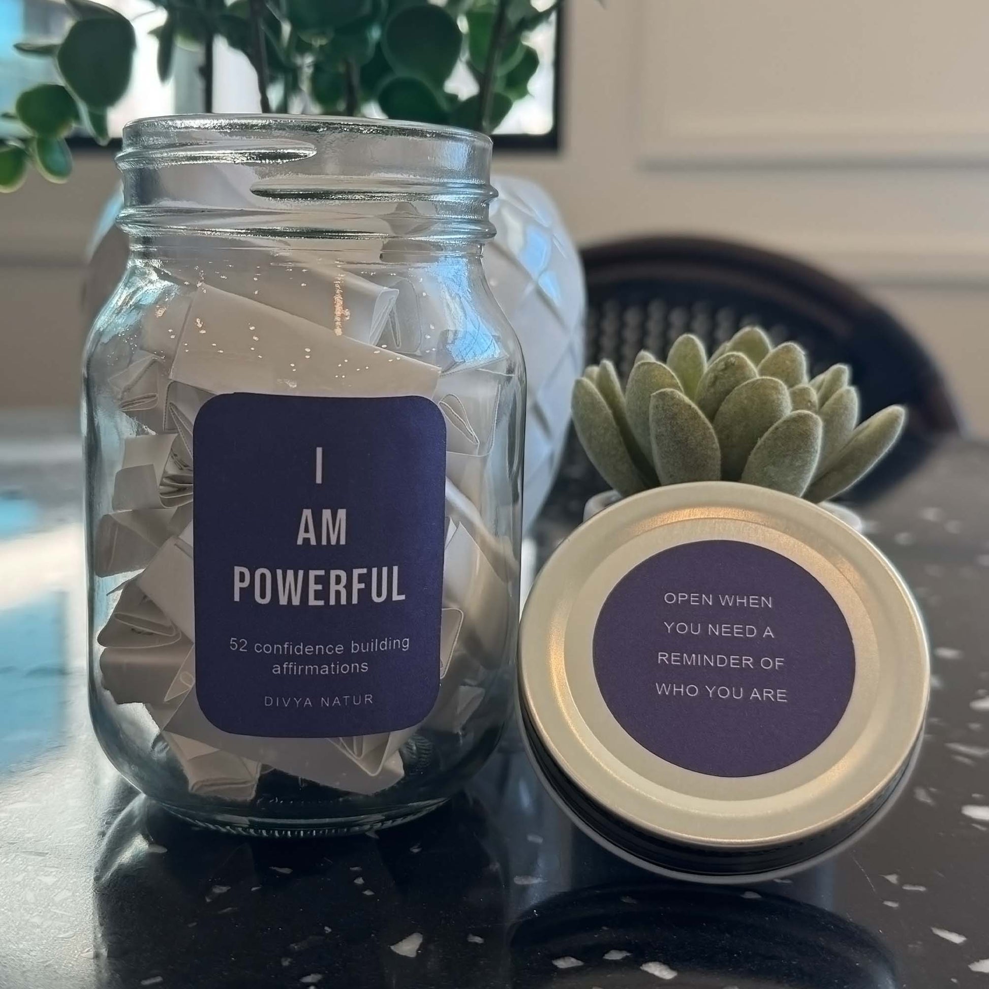 Glass jar filled with motivational affirmation notes to boost confidence and encourage positive thinking