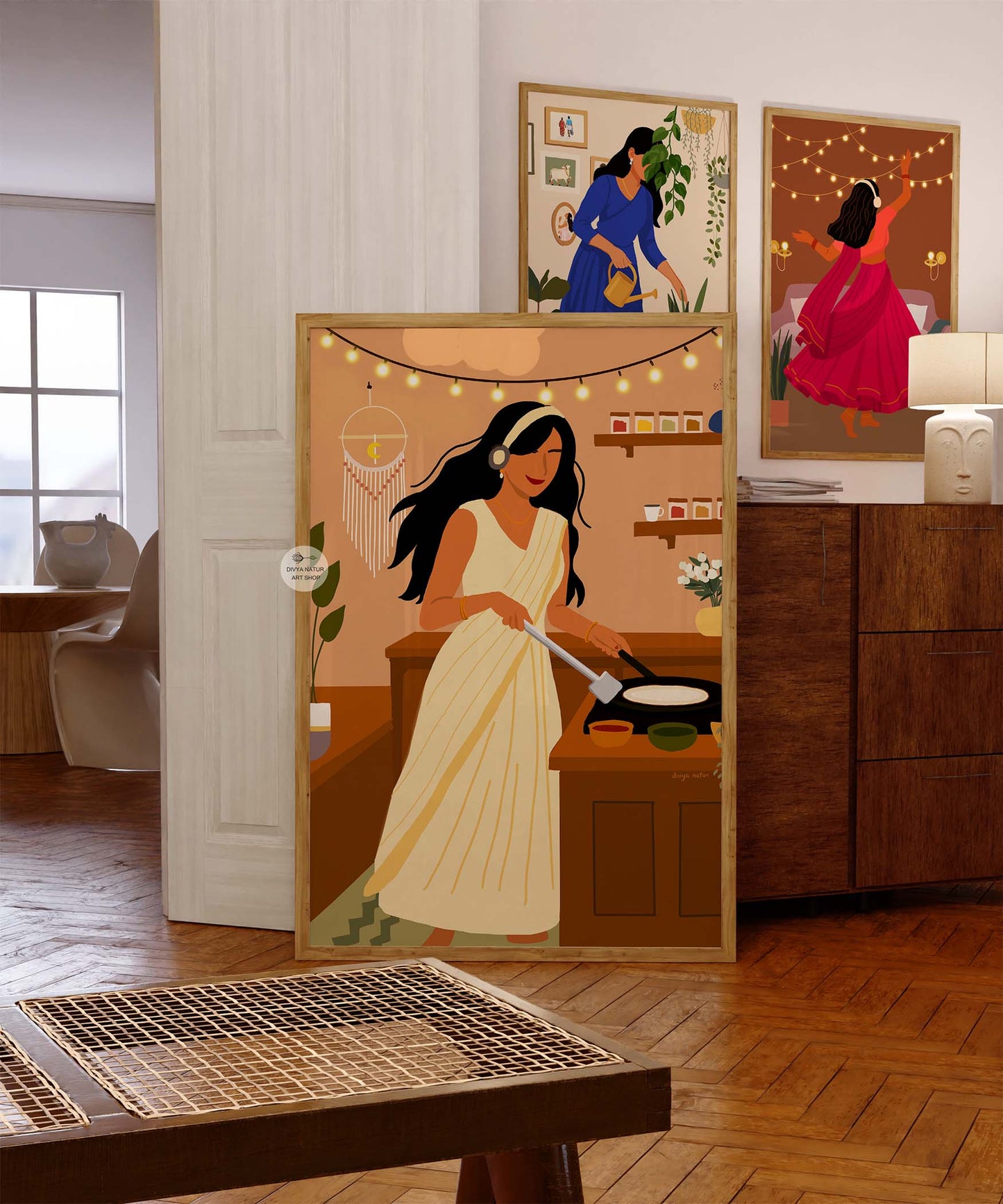 Cultural wall decor featuring woman in saree preparing dosa on hot pan