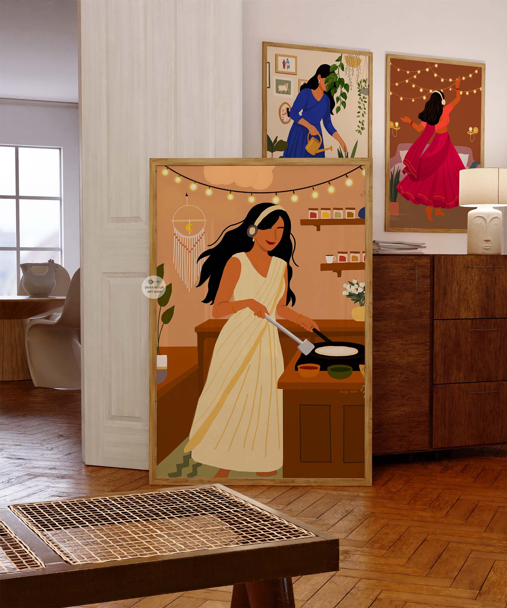 Cultural wall decor featuring woman in saree preparing dosa on hot pan
