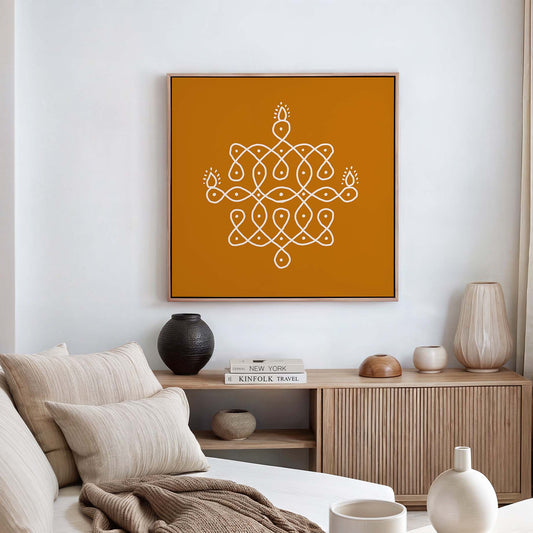 South Indian kolam rangoli wall art with white sacred geometric pattern on warm orange background