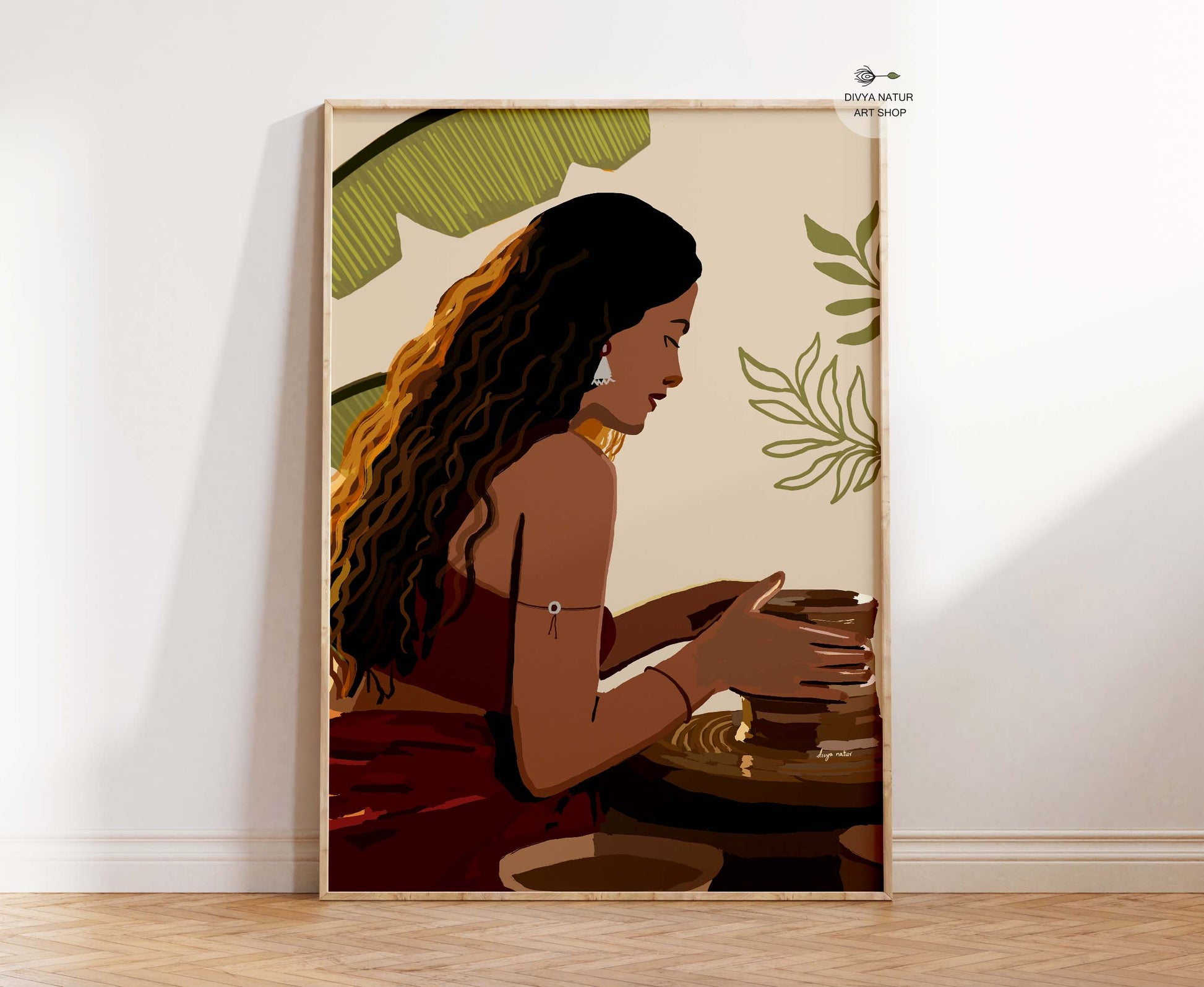Indian-inspired art print showing woman making pottery in earthy colors and soft tropical background