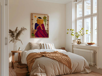 A colorful framed art print depicting a woman in a red dress under a yellow sun hangs on a beige wall above a bed in a bright, modern bedroom with a window, plants, and neutral-toned bedding.