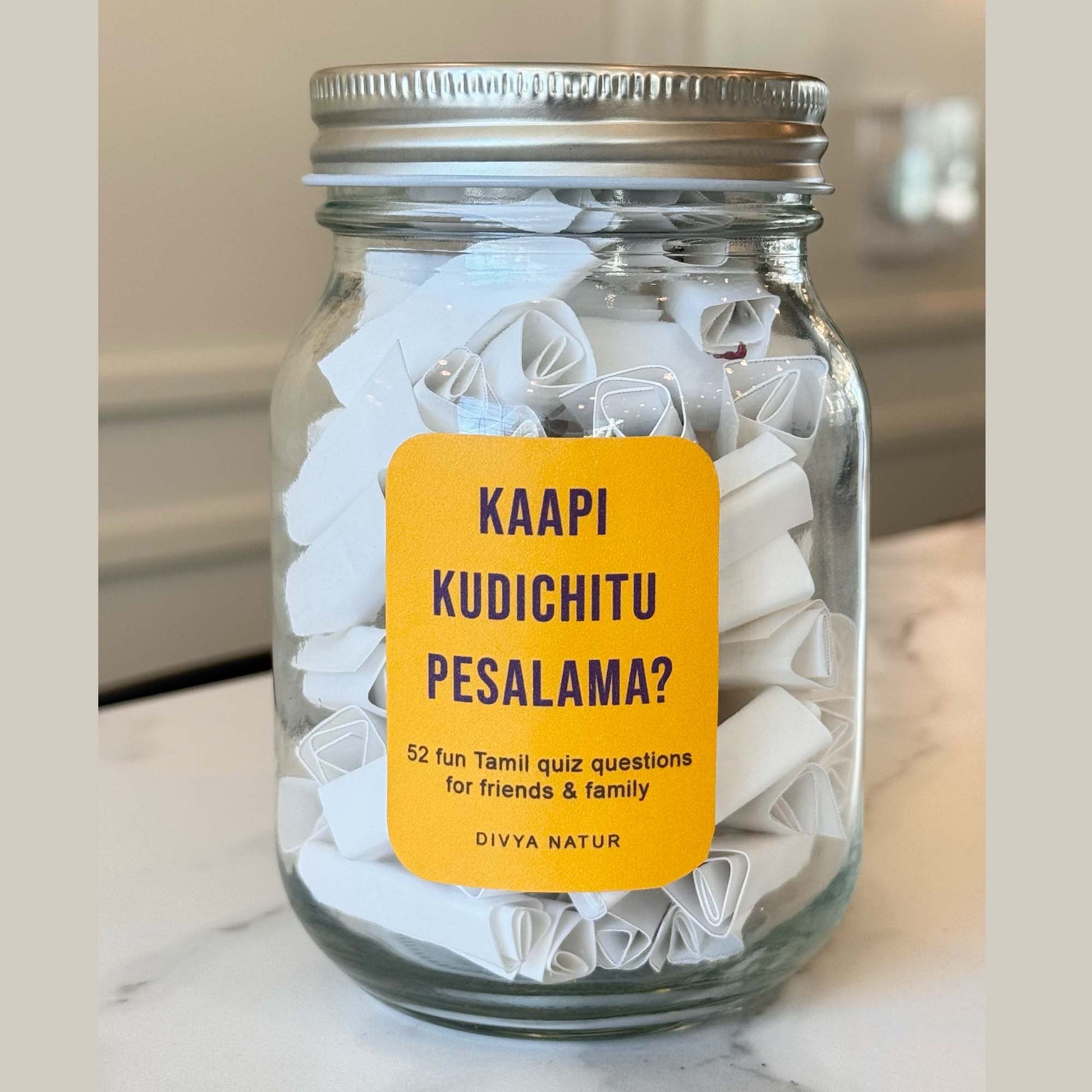 Tamil game night game jar with chits containing tamil cultural questions