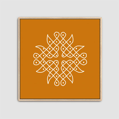 Framed artwork with a white Rangolidesign on an orange background