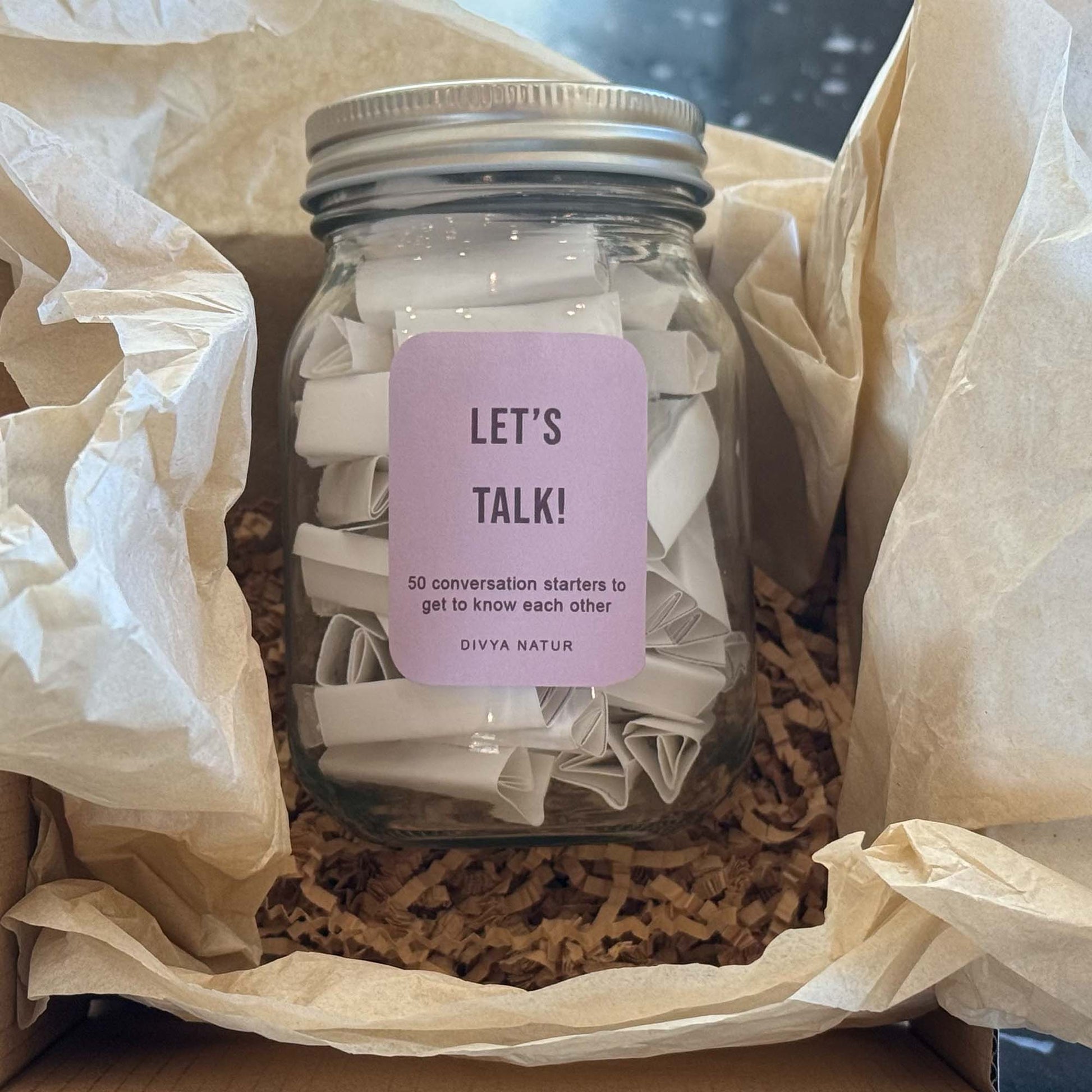Conversation starter jar with fun question prompts for friends and family gatherings