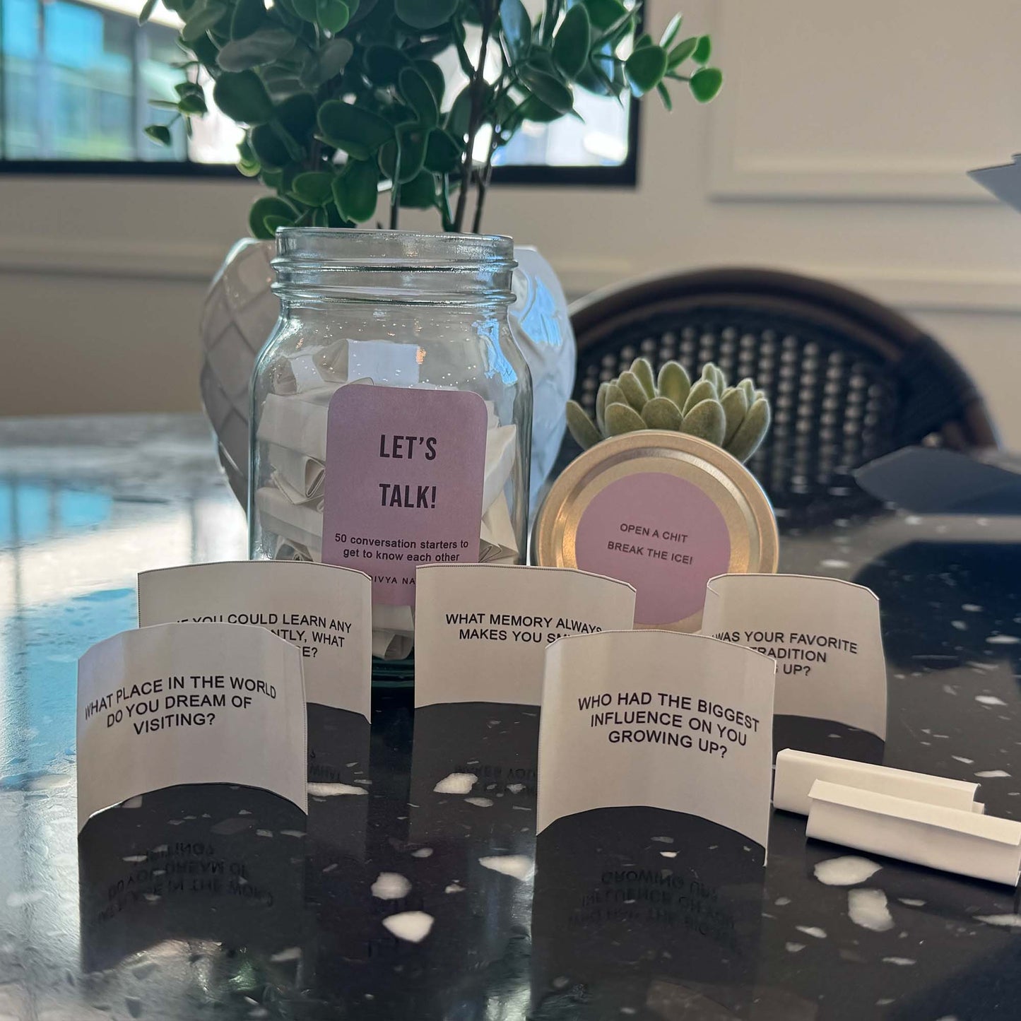 Glass conversation jar filled with questions designed to spark meaningful discussions