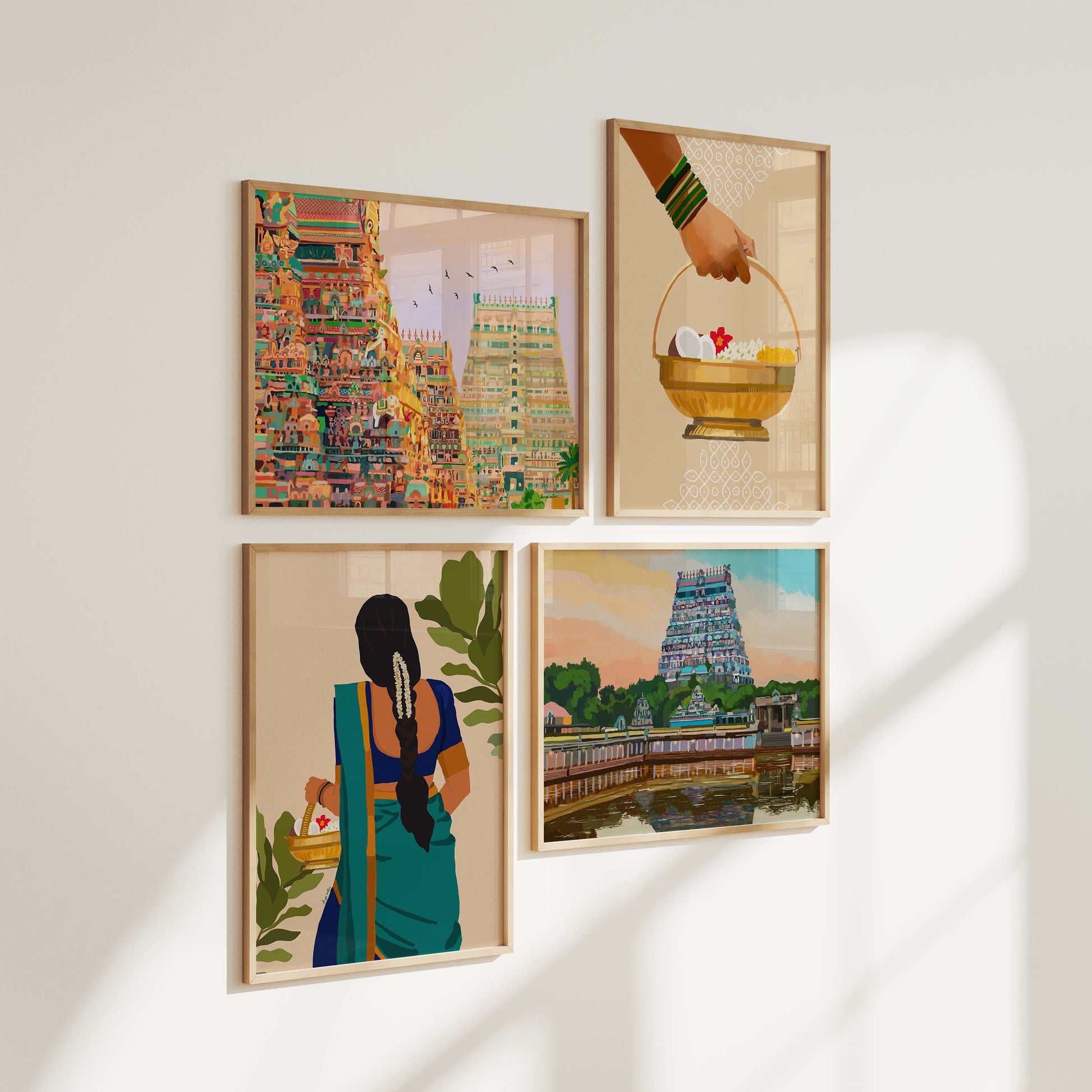 Four framed South Indian temple art prints arranged in a grid featuring Srirangam gopuram, Chidambaram temple at sunset, a Tamil woman in blue saree with jasmine braid, and a brass puja basket with flowers