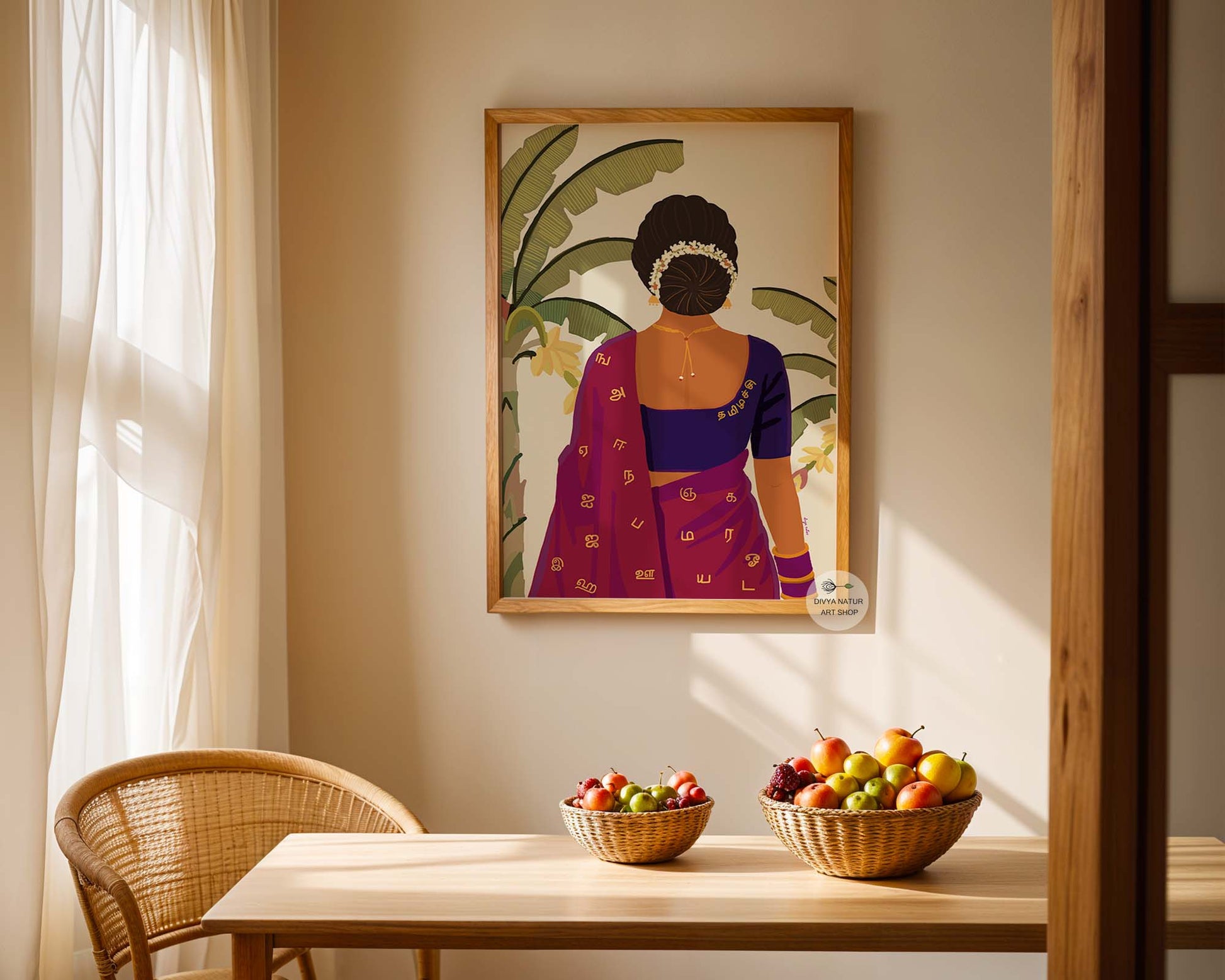 Framed artwork of a woman in traditional attire on a wall above a table with fruit bowls.