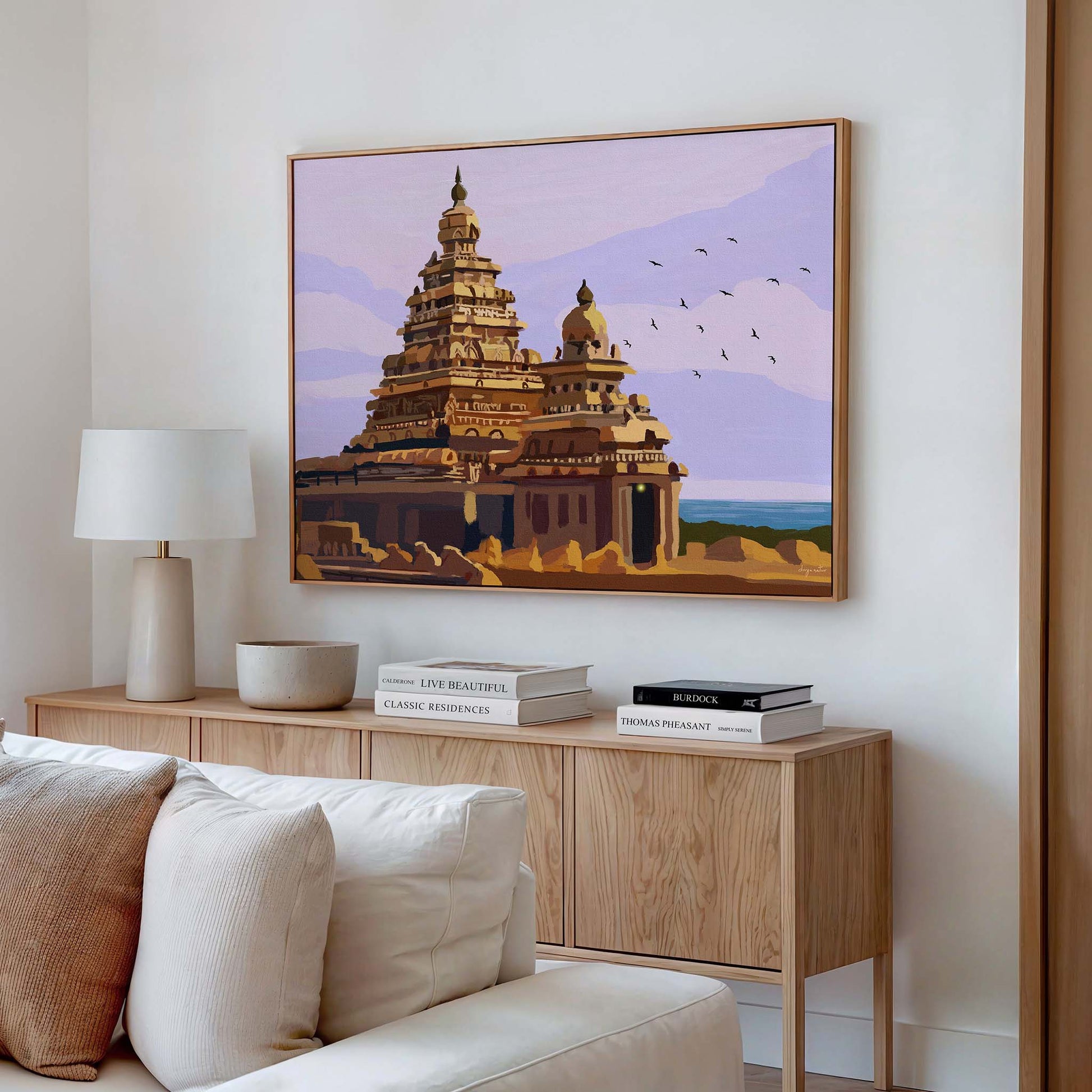 South Indian temple wall decor with painterly details and calming lavender sky background.