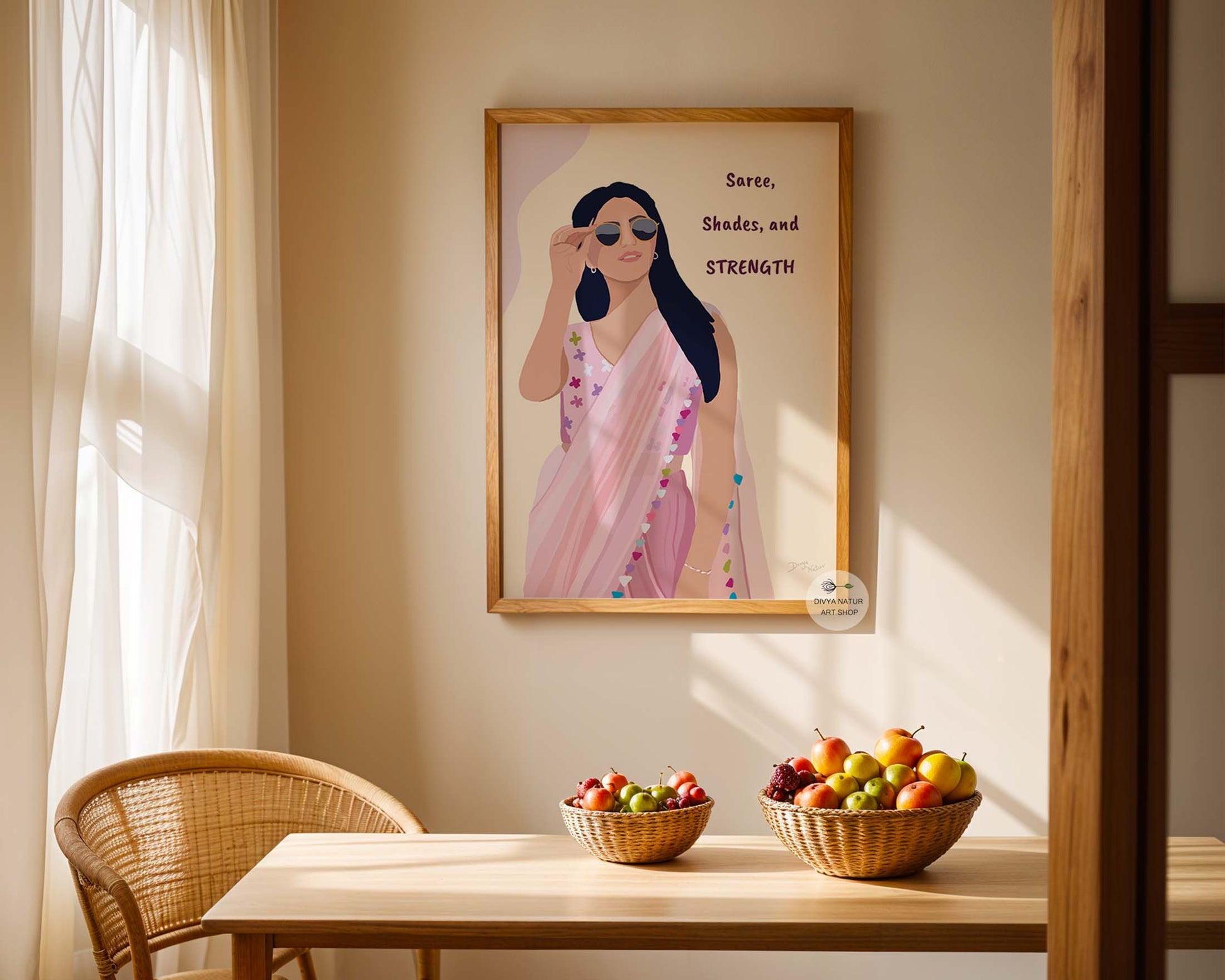 "Saree, Shades, and Strength" art print featuring a bold woman in a pink saree.
