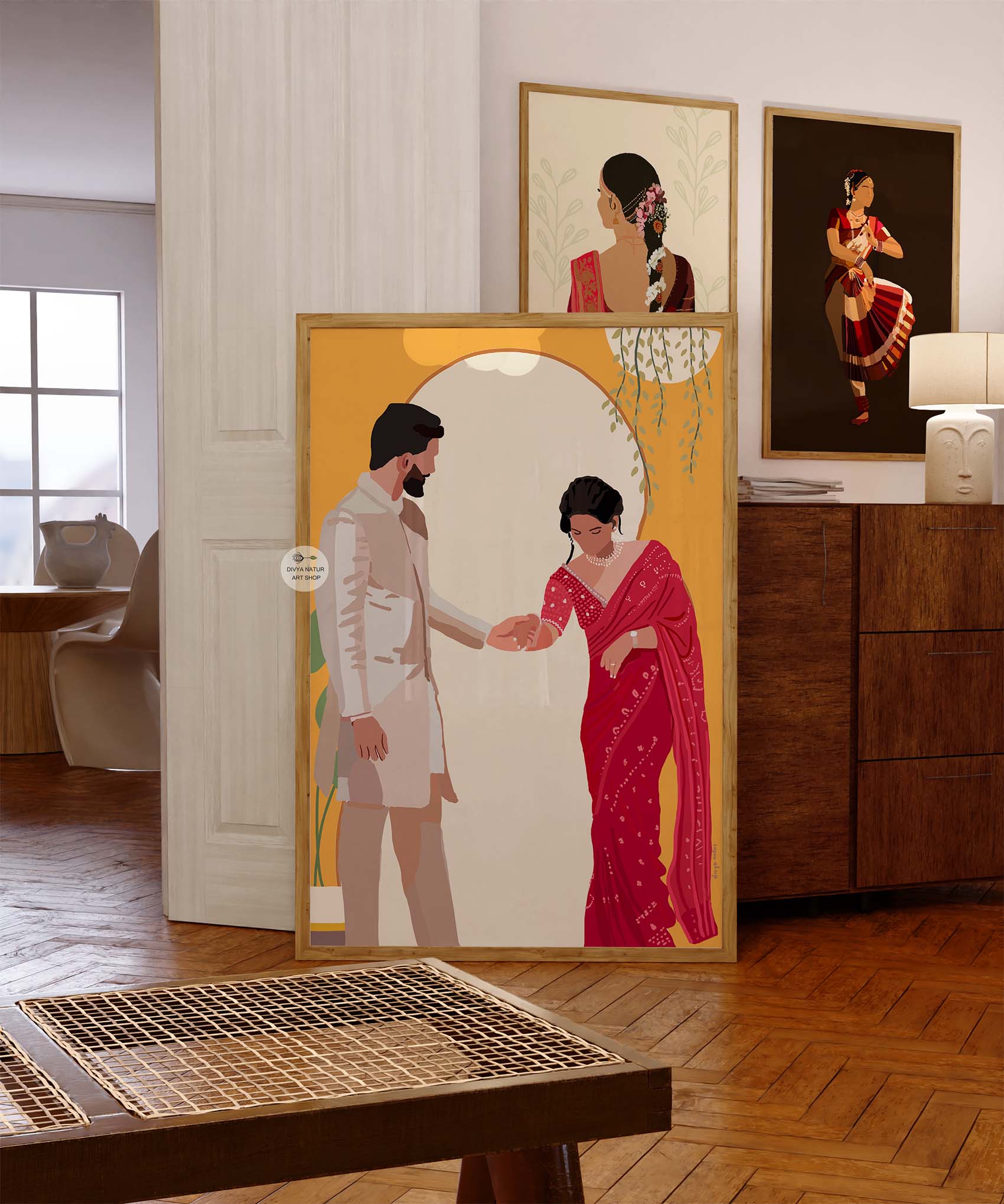 Elegant Indian bride in a red saree and groom in a beige sherwani.