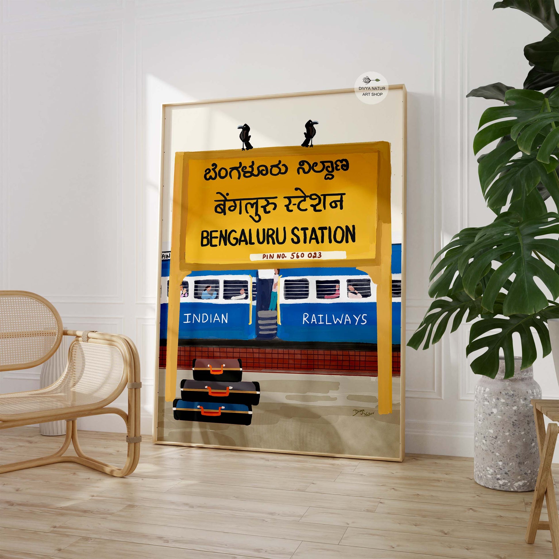 Hand-painted artwork of an Indian railway station featuring blue train coaches and passengers.
