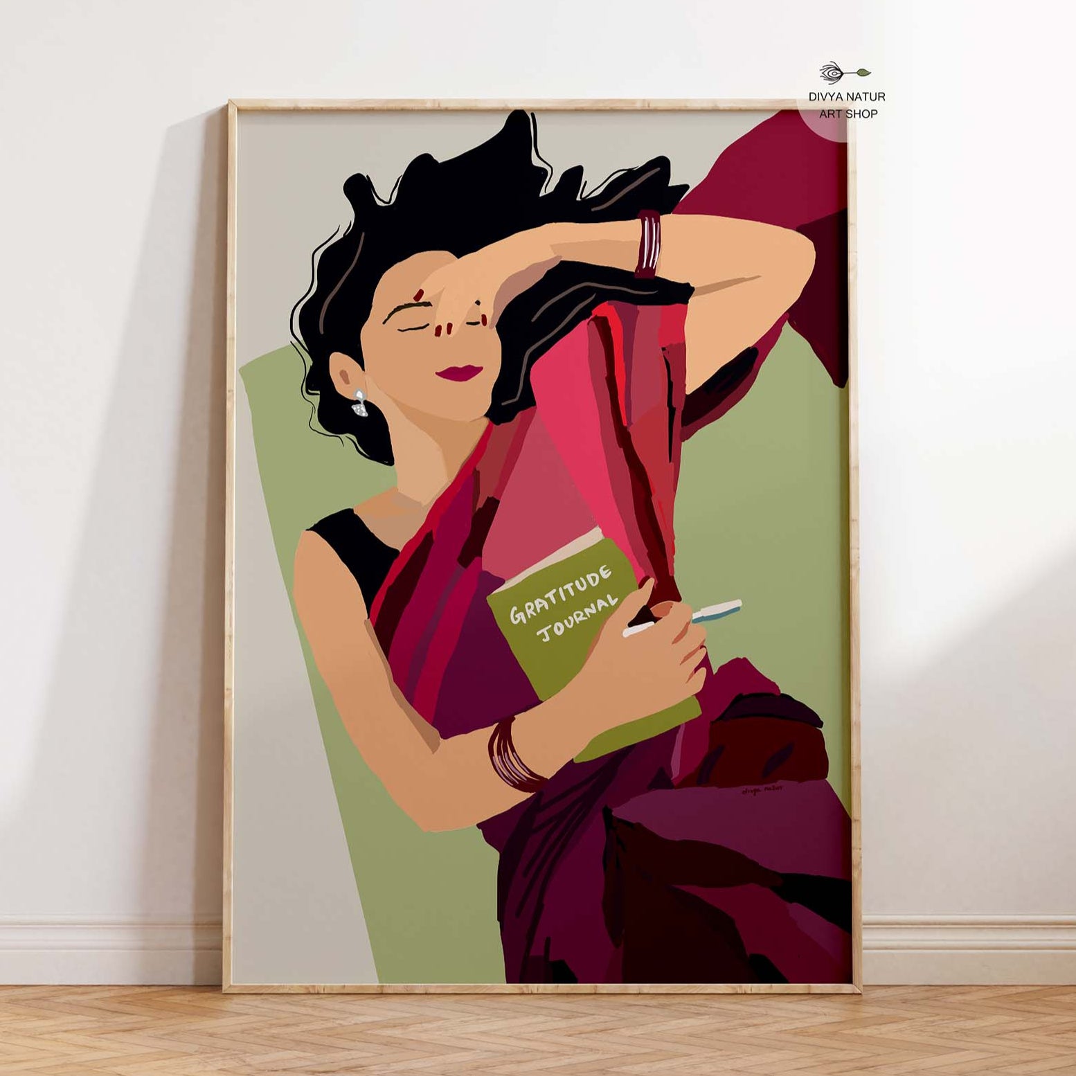 Digital painting of an Indian woman in a saree holding a gratitude journal.