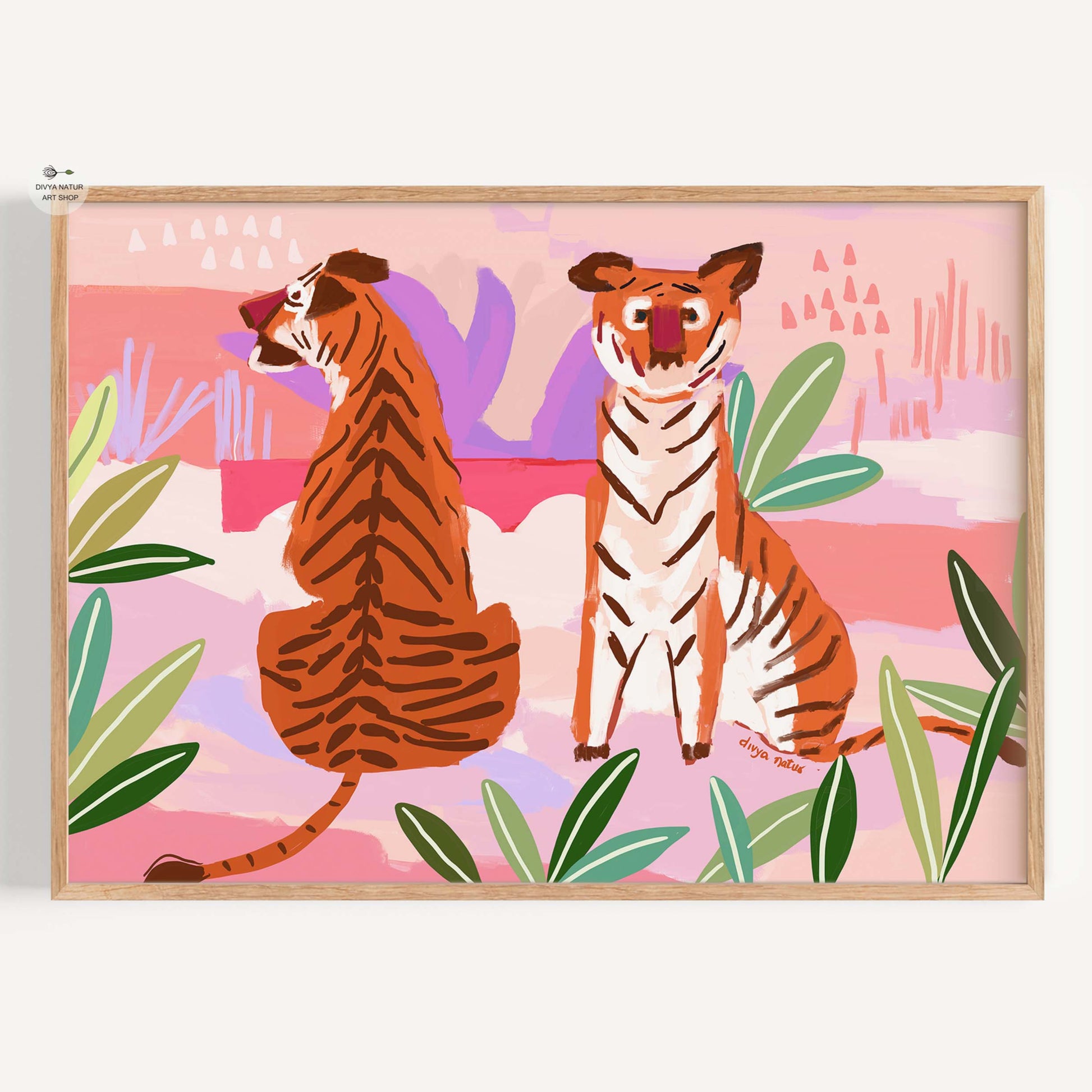 Framed artwork of two tigers in a tropical setting with pink background