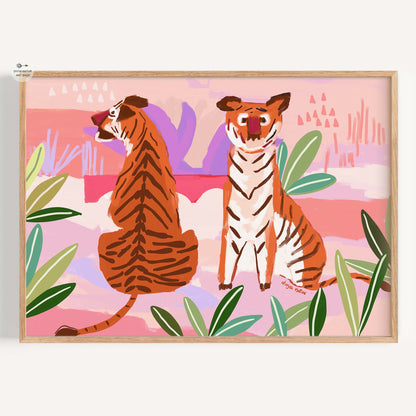 Framed artwork of two tigers in a tropical setting with pink background