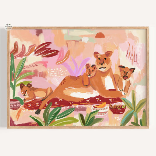 Framed artwork of lions and cubs in a jungle setting with a warm color palette.