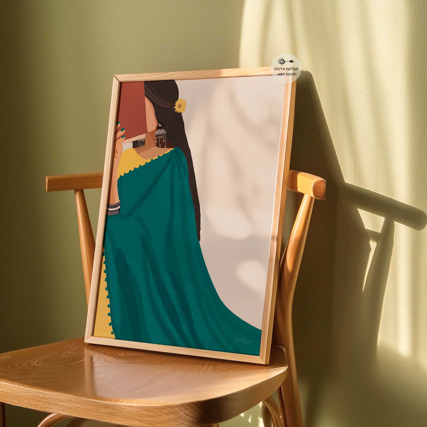 Traditional Indian woman in a green saree engaged in reading.