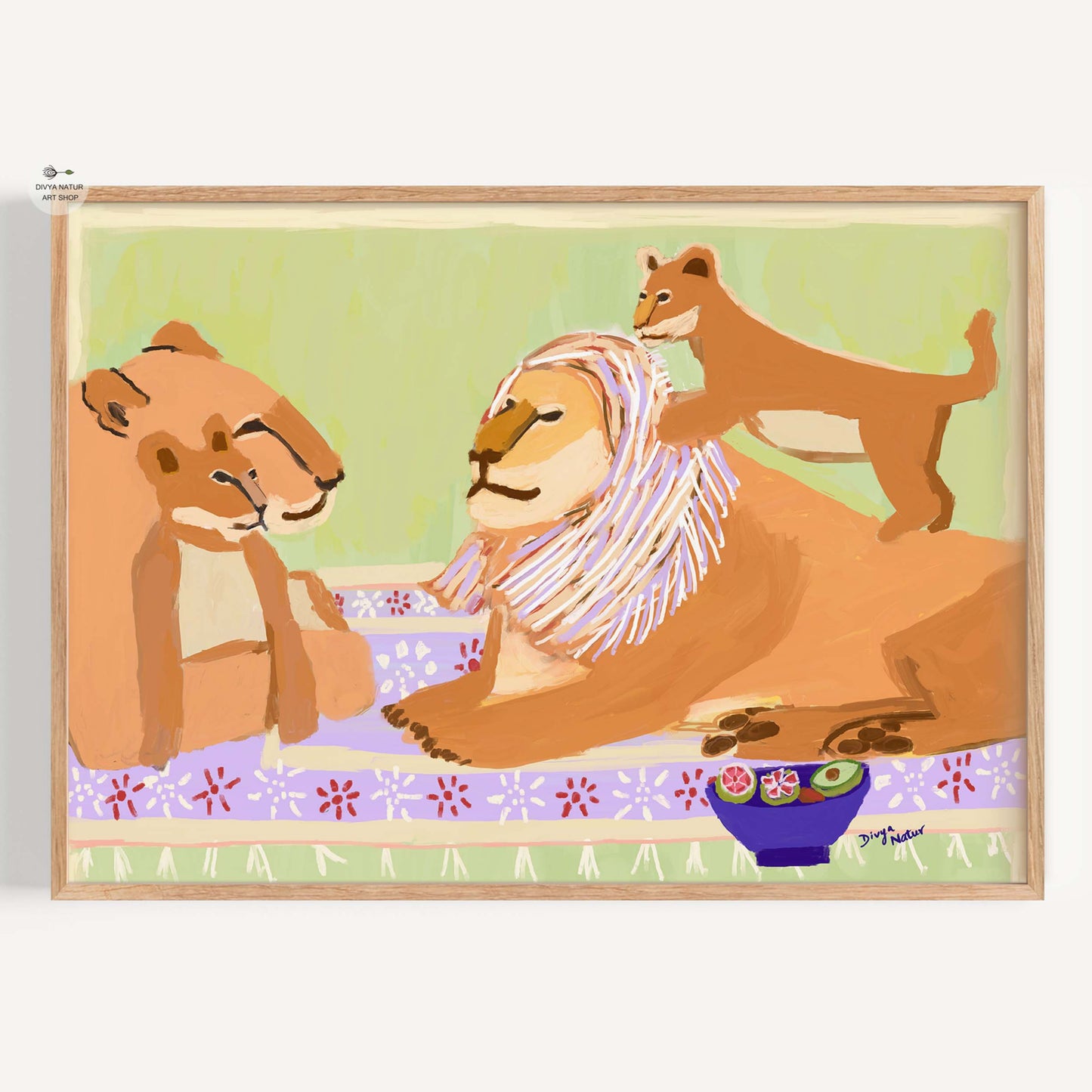 Framed artwork of a lion family with two cubs on a light green background.